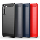 the back and sides of the red, black, and blue carbon carbon case