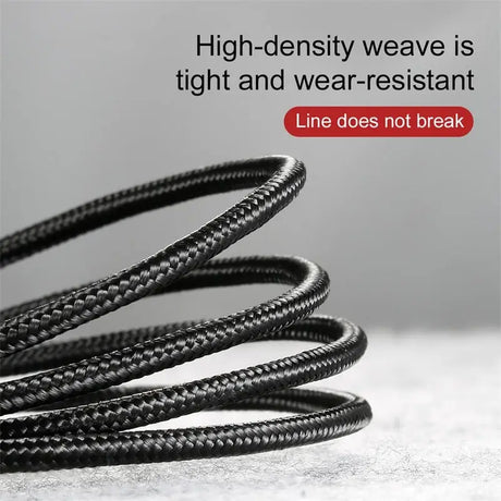 a black leather bracelet with a red button on it