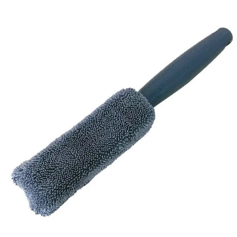 a black brush with a black handle