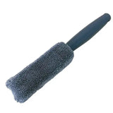 a black brush with a black handle