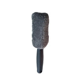 a black brush with a black handle