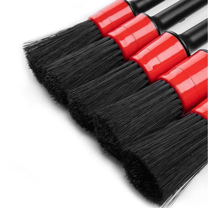 a set of three red brushes