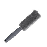 a black brush with a black handle