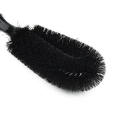 a black brush with a black handle