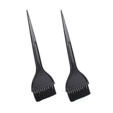 two black plastic hair brushes on a white background
