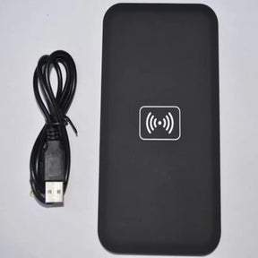 a black box with a usb and a cable