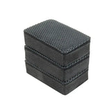 a close up of a black leather box with a white background