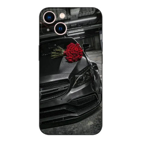 A black car with a red rose on the hood of a car phone case