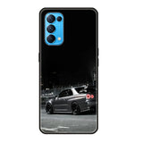 a black car on the street at night phone case