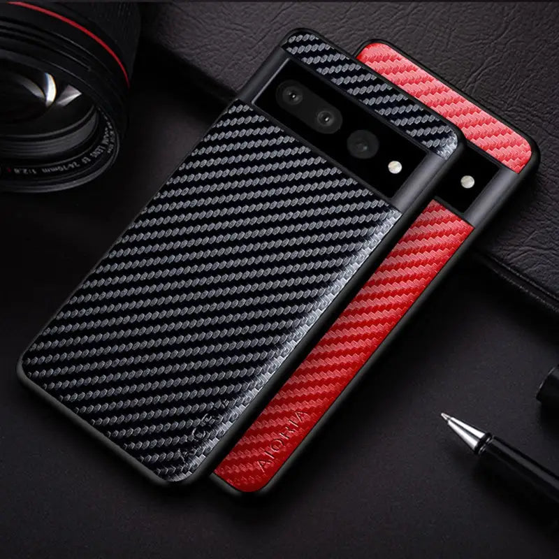 a red and black carbon fiber case with a pen and camera
