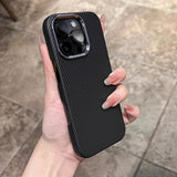 A black carbon fiber phone case with a silver camera bezel.