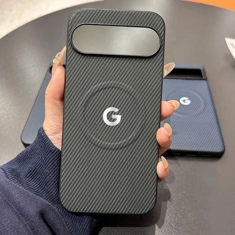 A black carbon fiber phone case with a camera cutout and a white Google ’G’ logo.