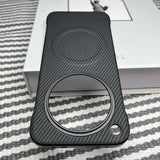 Black carbon fiber phone case with a large circular cutout and a smaller circular cutout.