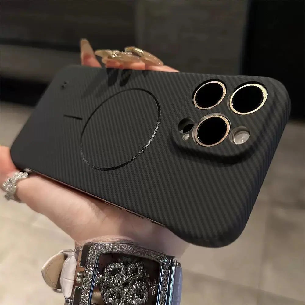 Black carbon fiber phone case with MagSafe compatibility and reinforced camera cutouts.