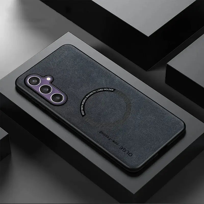 the back of a black case with a circular design on it