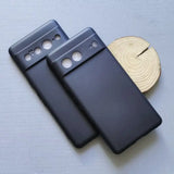 two black cases with a wooden slice on top