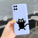 a black cat with a yellow sticker on its nose