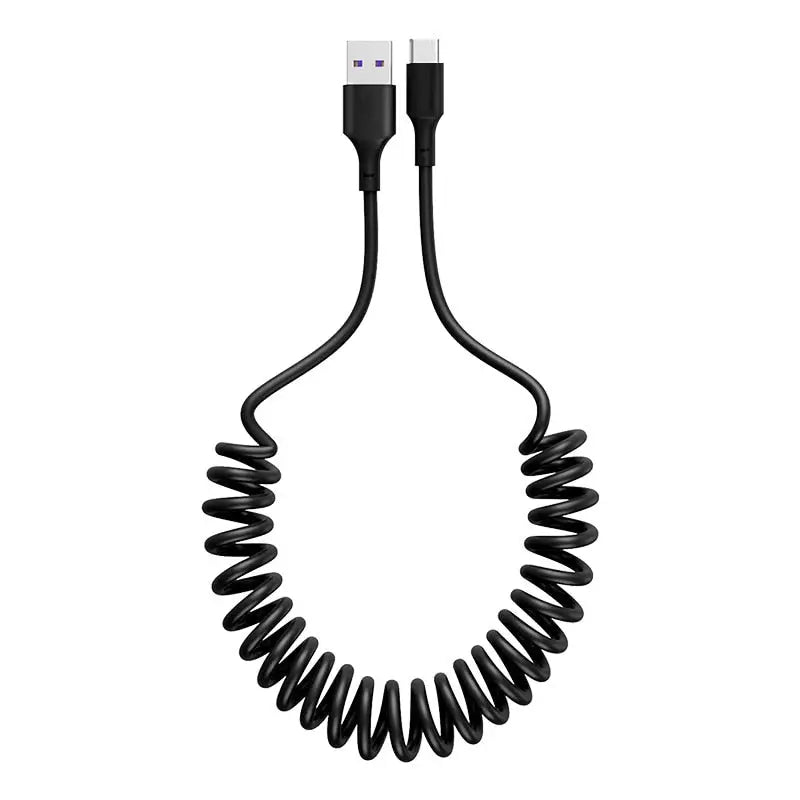 a black coiled cable connected to a white background