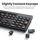 Black computer keyboard with slightly concave keycaps designed for better fingertip fit.