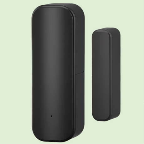 Black cylindrical smart home sensor or security device with a smaller companion unit.