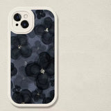 the black floral iphone case is shown on a white surface