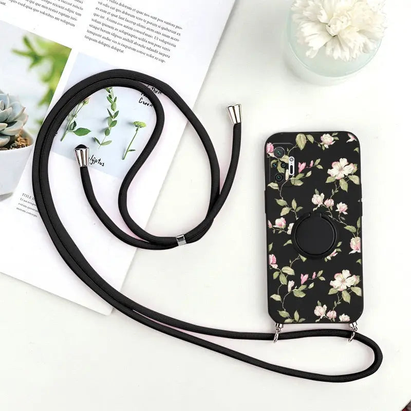 a black phone case with a flower pattern on it