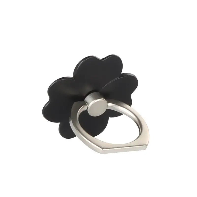 a black flower ring with a silver ring