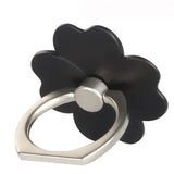 a black flower shaped ring with a silver ring