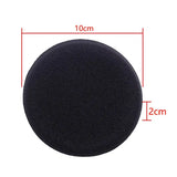 a black foam ball with a white background