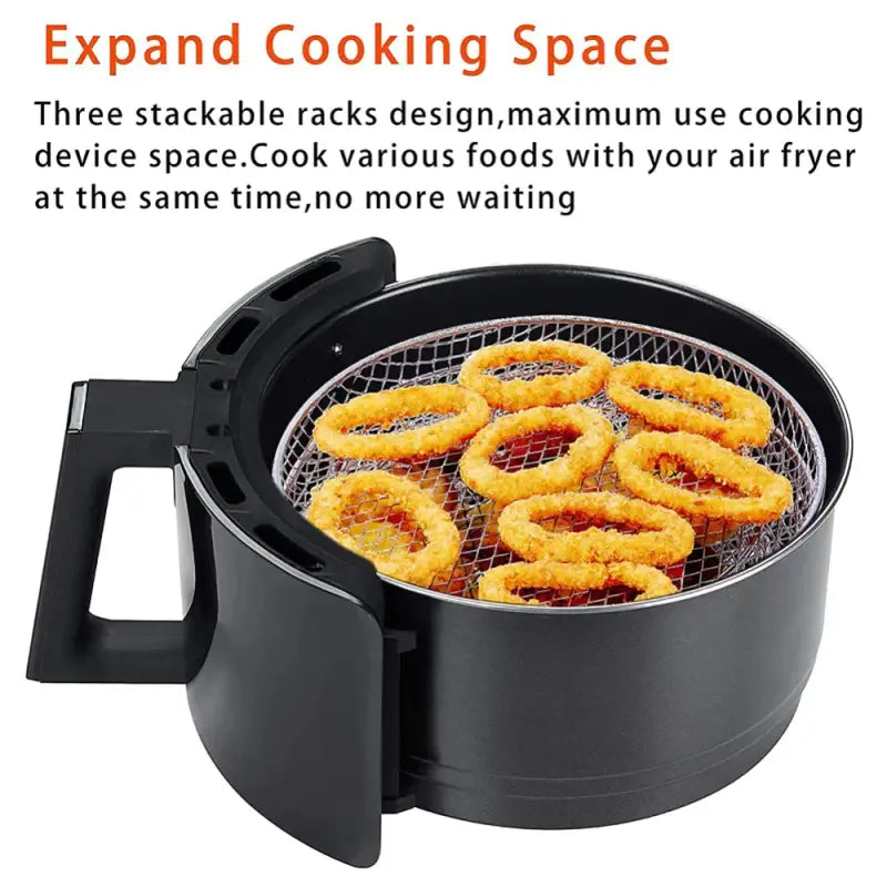 a black fryer with fried shrimp on it