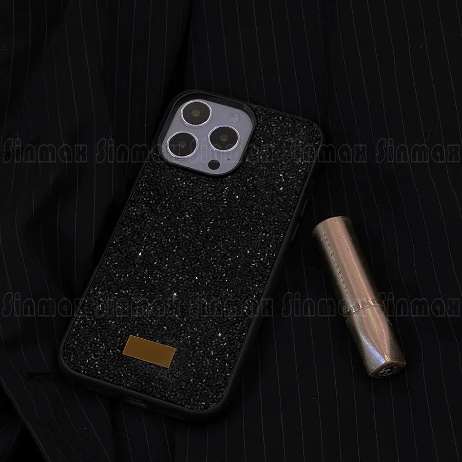 the black glitter iphone case is shown with a gold lipstick