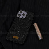 the black glitter iphone case is shown with a gold lipstick