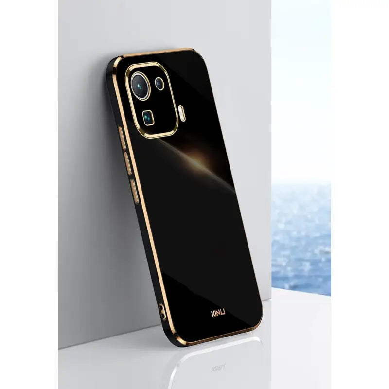 the back of a black and gold iphone case
