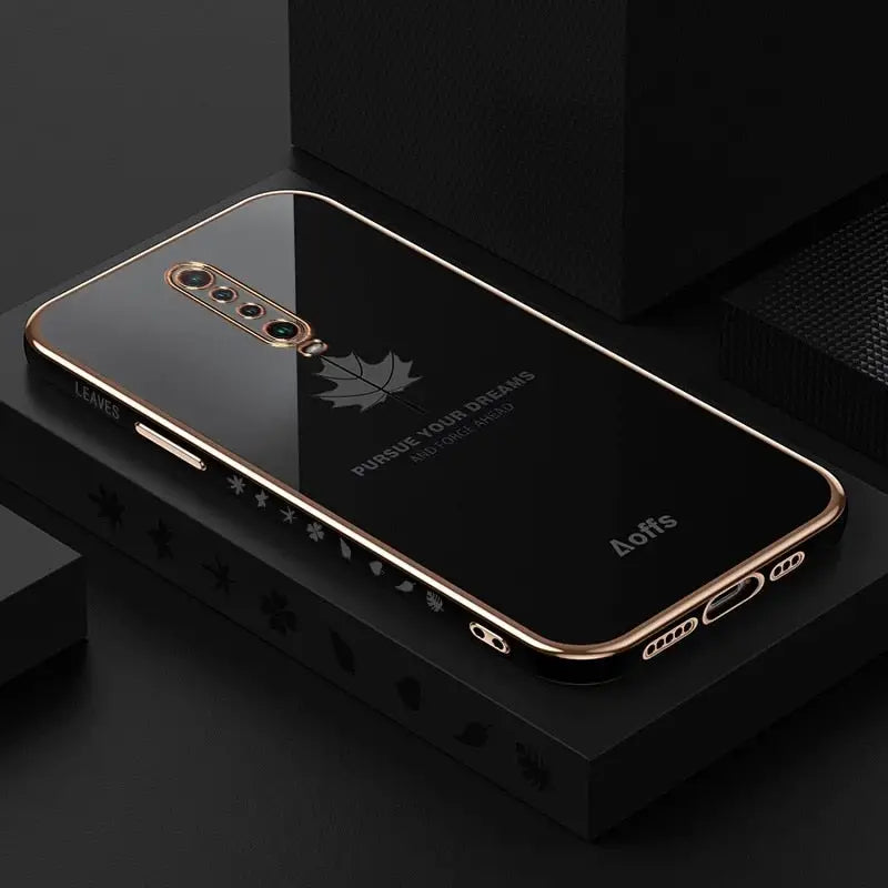 the back of a black and gold iphone