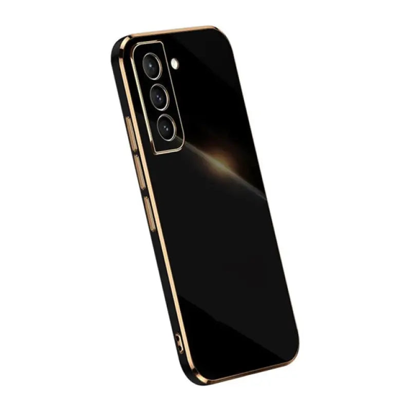 the back of a black and gold iphone case