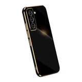 the back of a black and gold iphone case