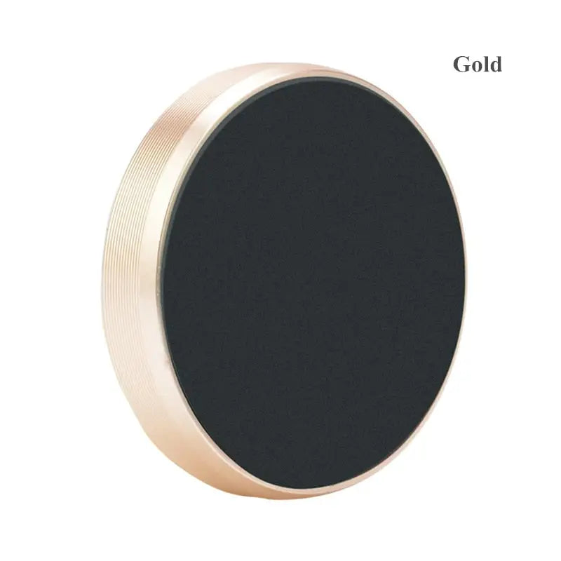 a black and gold metal knob with a round shape