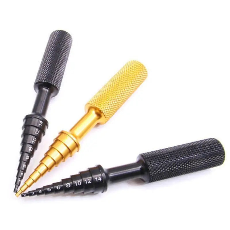 two black and gold screws with a yellow tip