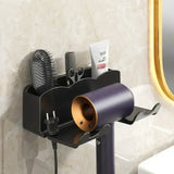 a black hair dryer on a wall