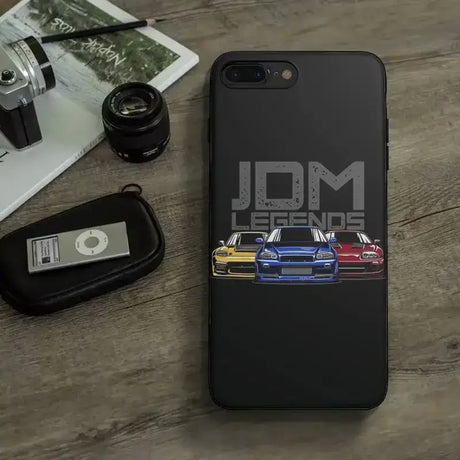 The back of a black iphone case with a car on it