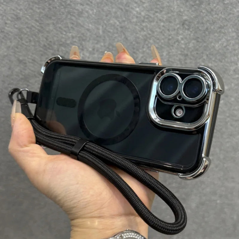Black iPhone case with chrome accents, a MagSafe ring, and an attached wrist strap.