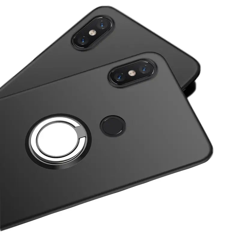 the back of a black iphone case with a circular ring