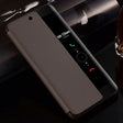 the back of a black iphone case with a glass bottle and a glass bottle