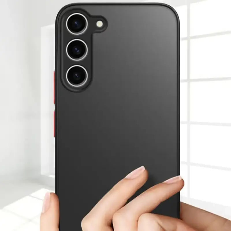 the back of a black iphone case with a hand holding it