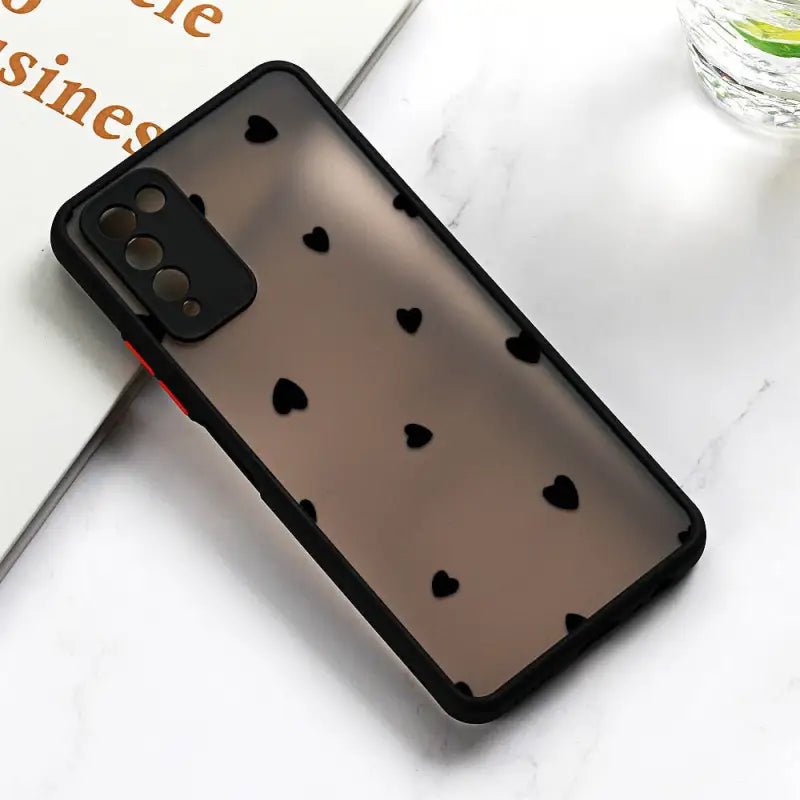 a black iphone case with hearts on it