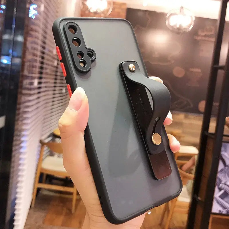 the back of a black iphone case with a black leather handle
