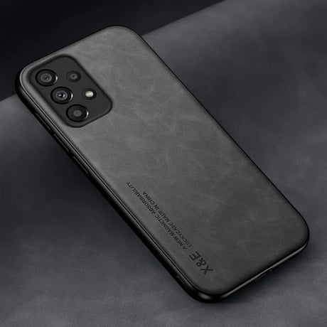 the back of a black iphone case on a black surface