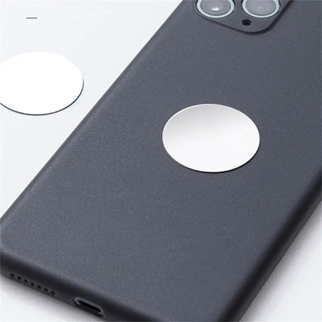 the back of a black iphone case with a white circle on it