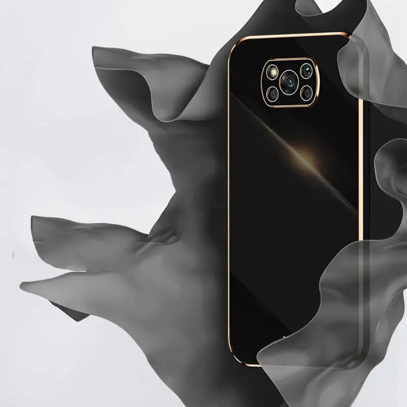 a black iphone with a gold frame