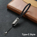 a black leather case with a metal clasp